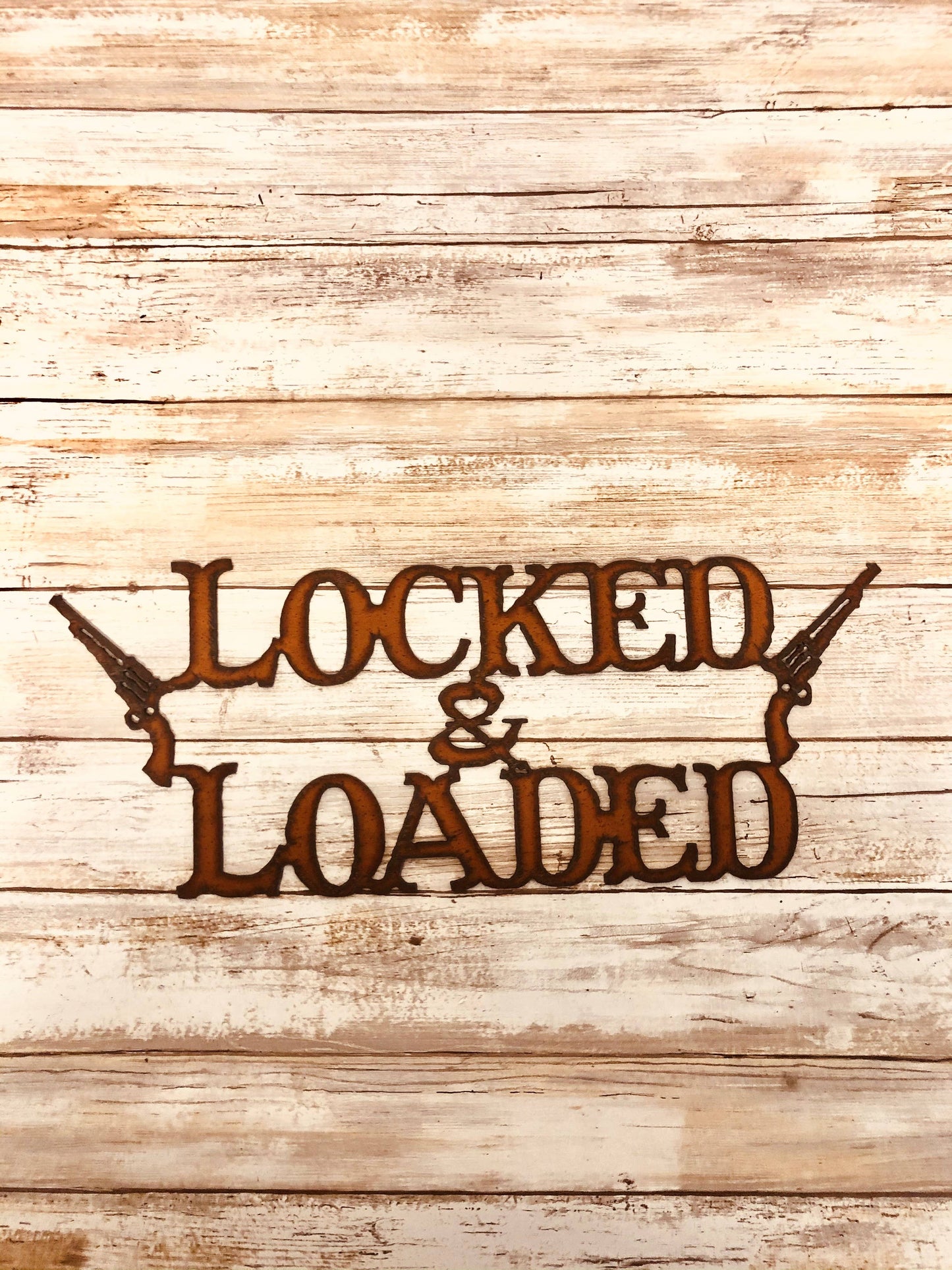 Locked and Loaded Gun Sign